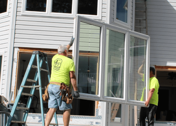 2 Men Installing a Replacement Window