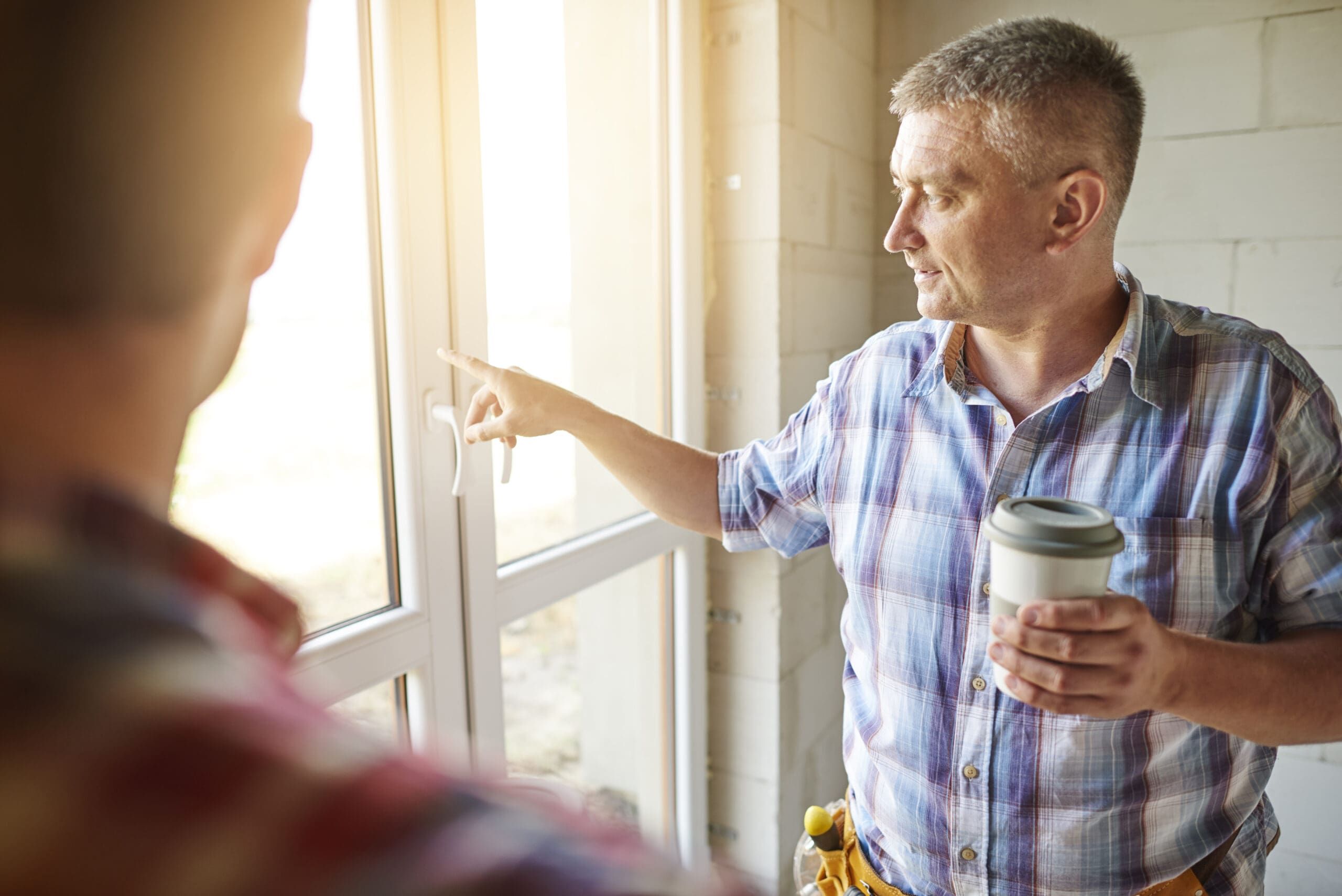 Window consultant listening to customer about window solutions